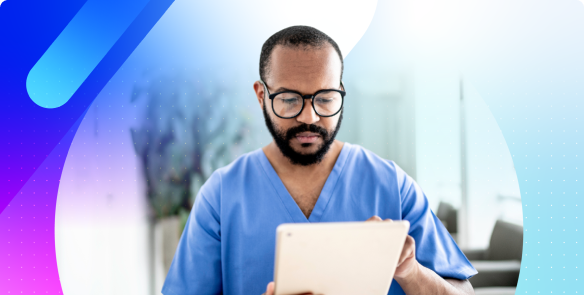 An eye care professional wearing scrubs and glasses focuses on a tablet device, appearing to review information.