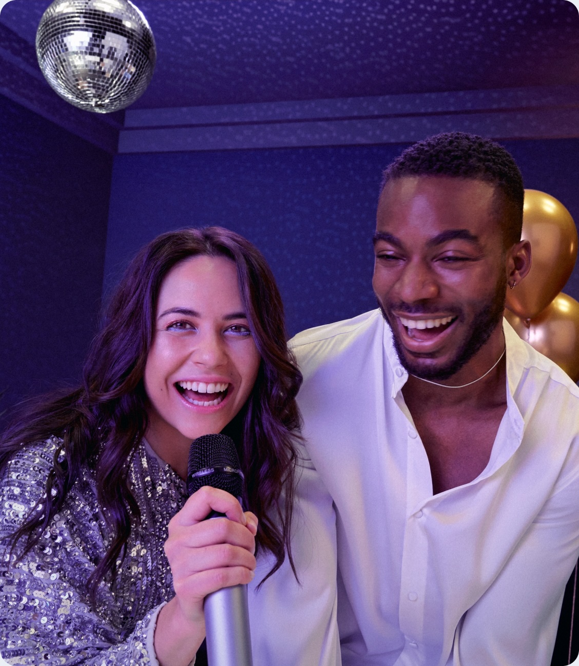 Image of two people with a microphone