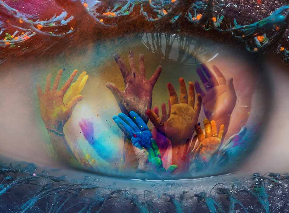 Close-up of an eye with a colorful artistic reflection of raised hands in the iris