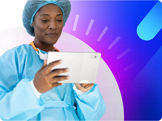 Ophthalmic surgeon in scrubs and a hairnet using a tablet in a clinical setting