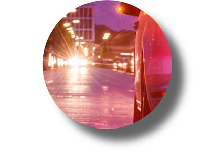 A nighttime view of streetlights with a strong starburst effect, representing visual disturbances