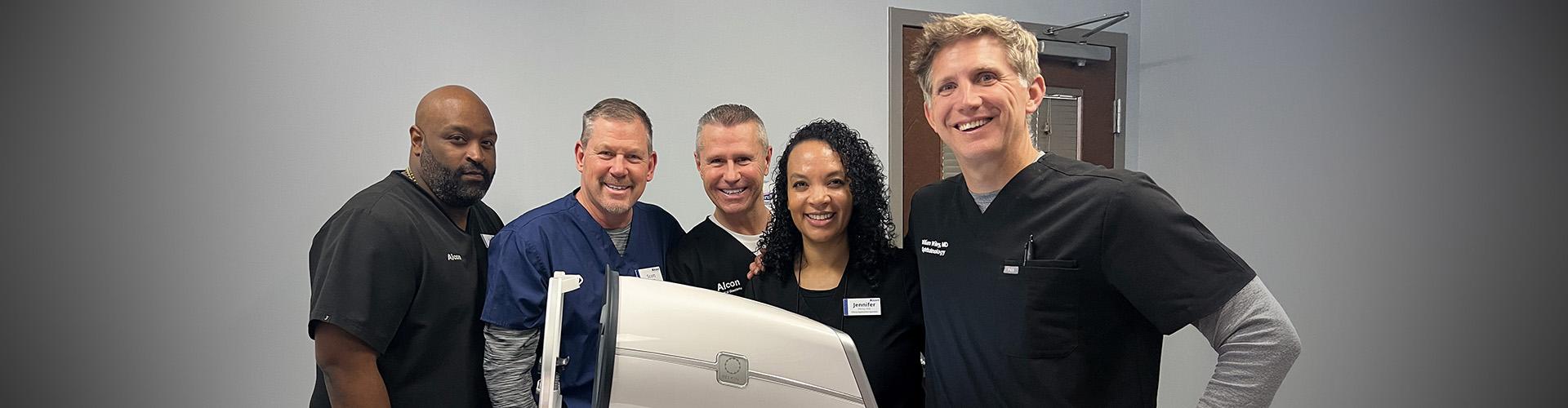 Group of smiling people at alcon product