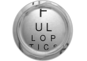 Close-up image of an enVista IOL with letters behind it, showing the use of the limited 4.9 mm aspheric optic.